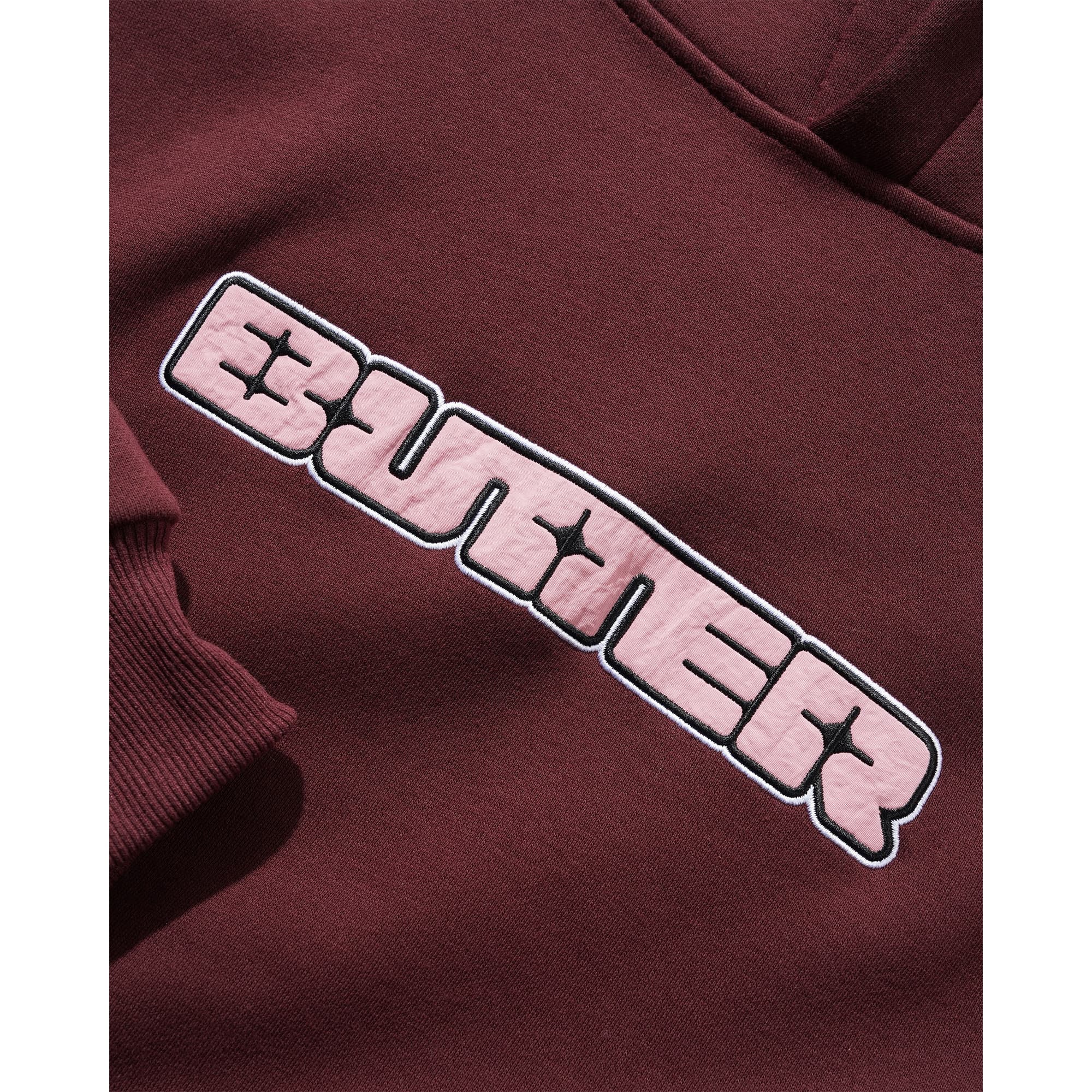 https://admin.plaze-shop.de/wp-content/uploads/2026/02/Glint-Nylon-Applique-Hoodie-burgundy-2.jpg