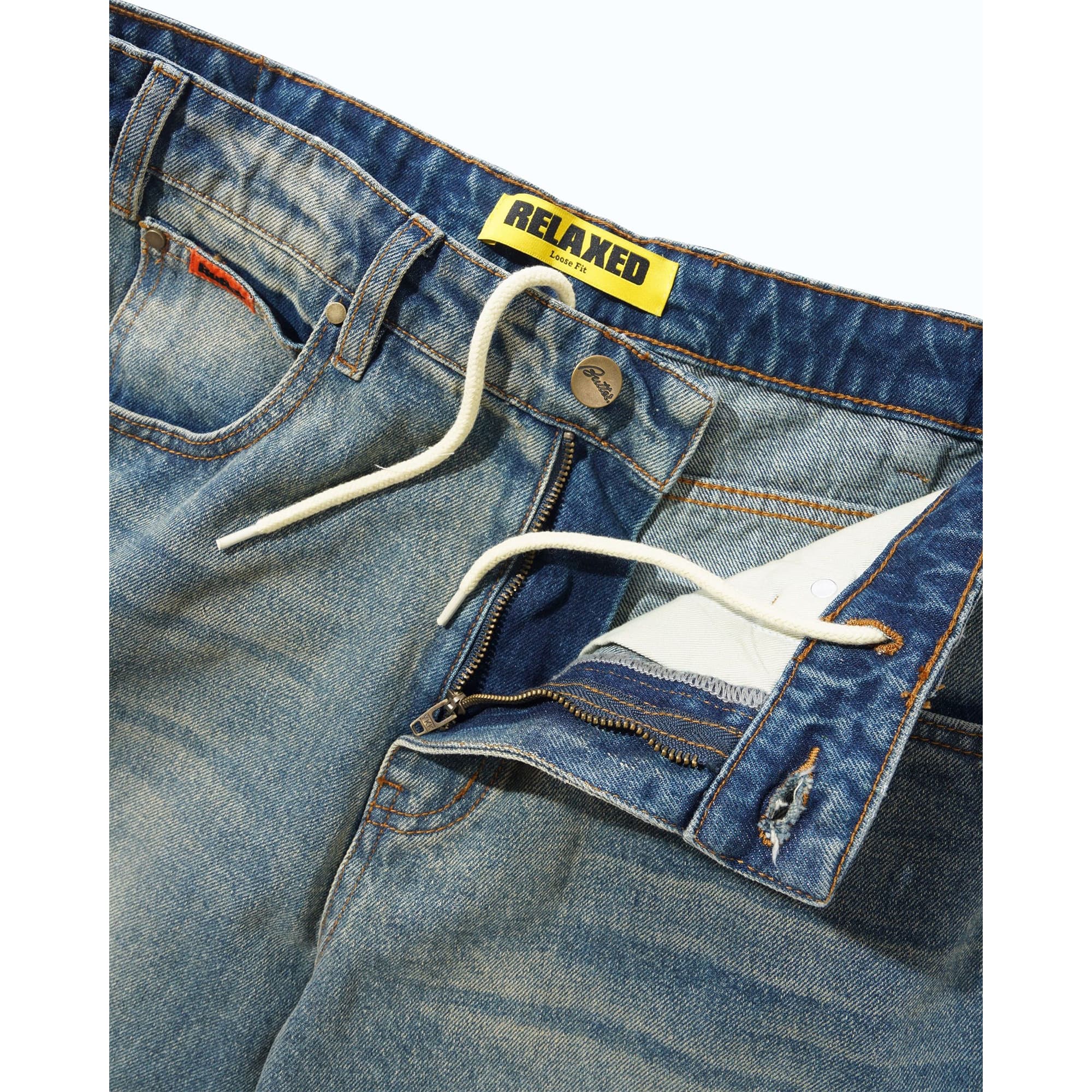 https://admin.plaze-shop.de/wp-content/uploads/2026/09/buttergoods_relaxed_denim_jeans_distressed_mid_blue_plaze-skateshop3.jpg