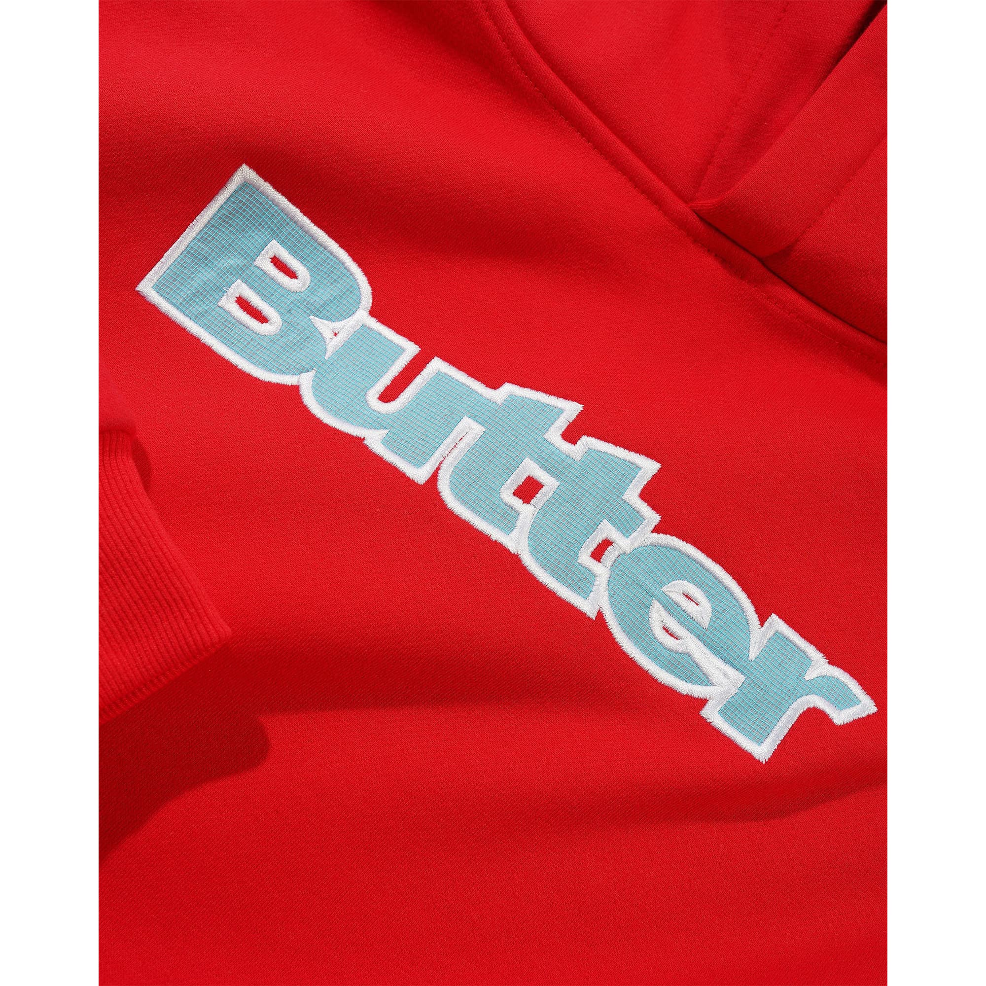 https://admin.plaze-shop.de/wp-content/uploads/2026/09/buttergoods_ripstop_logo_hood_applique_pullover_red_plaze-skateshop2.jpg