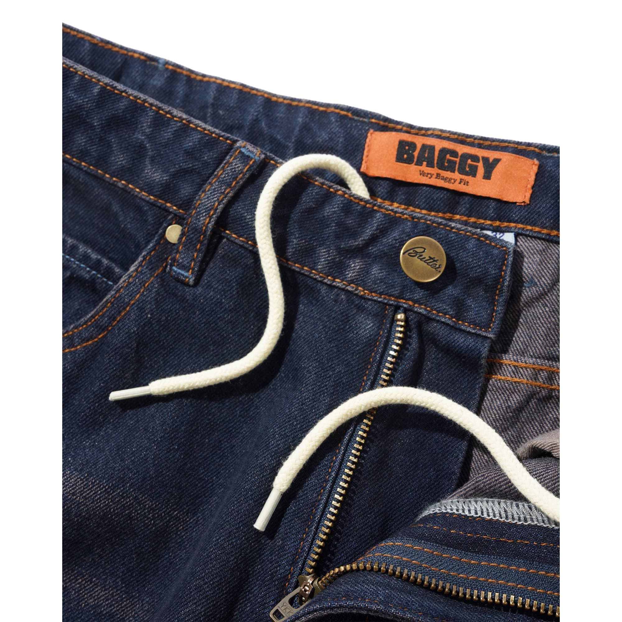 https://admin.plaze-shop.de/wp-content/uploads/2026/09/buttergoods_solar_fade_denim_jeans_tinted_dark_indigo_plaze-skateshop3.jpg