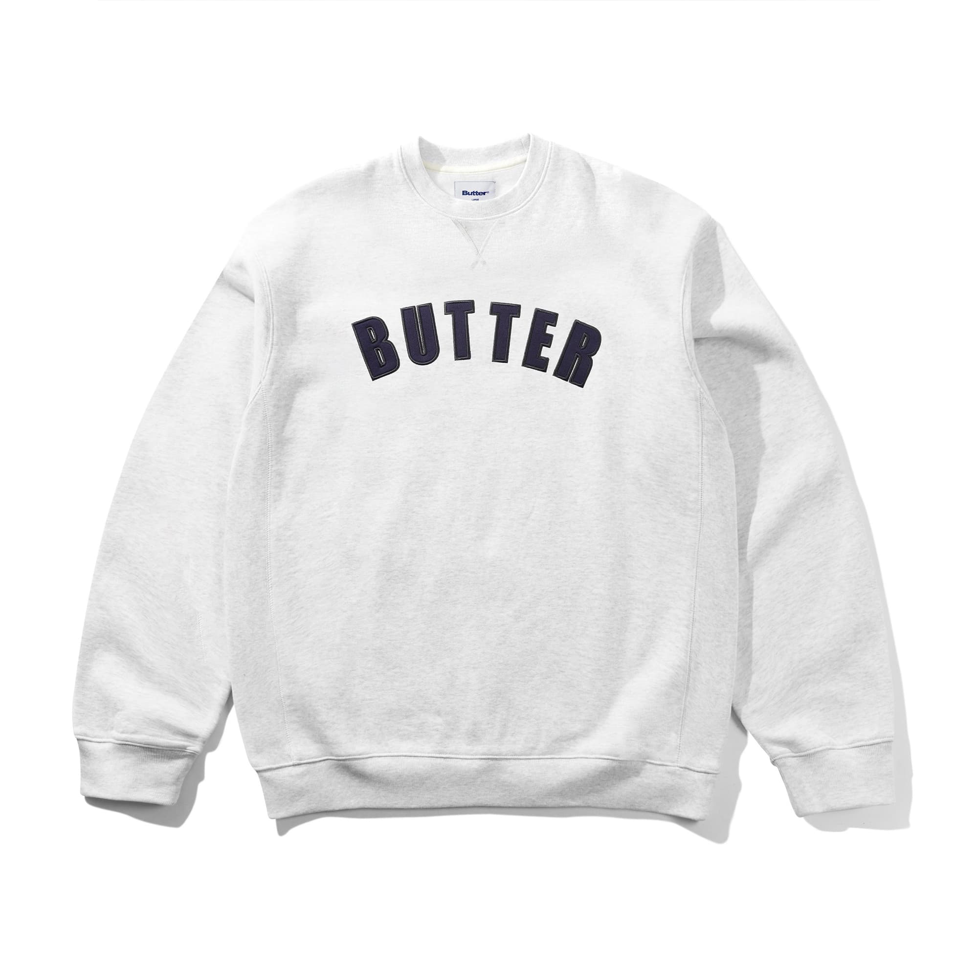 https://admin.plaze-shop.de/wp-content/uploads/2026/10/buttergoods_arc_applique_heavy_crewneck_ash_plaze-skateshop.jpg